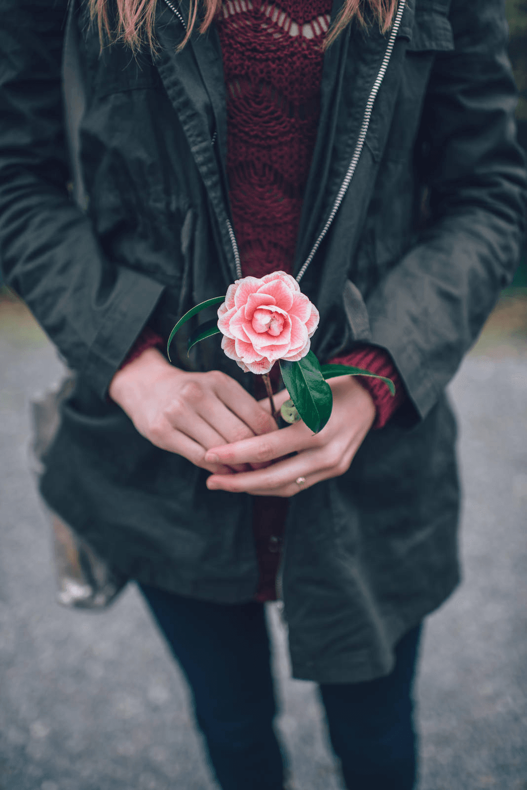 Person holding flower